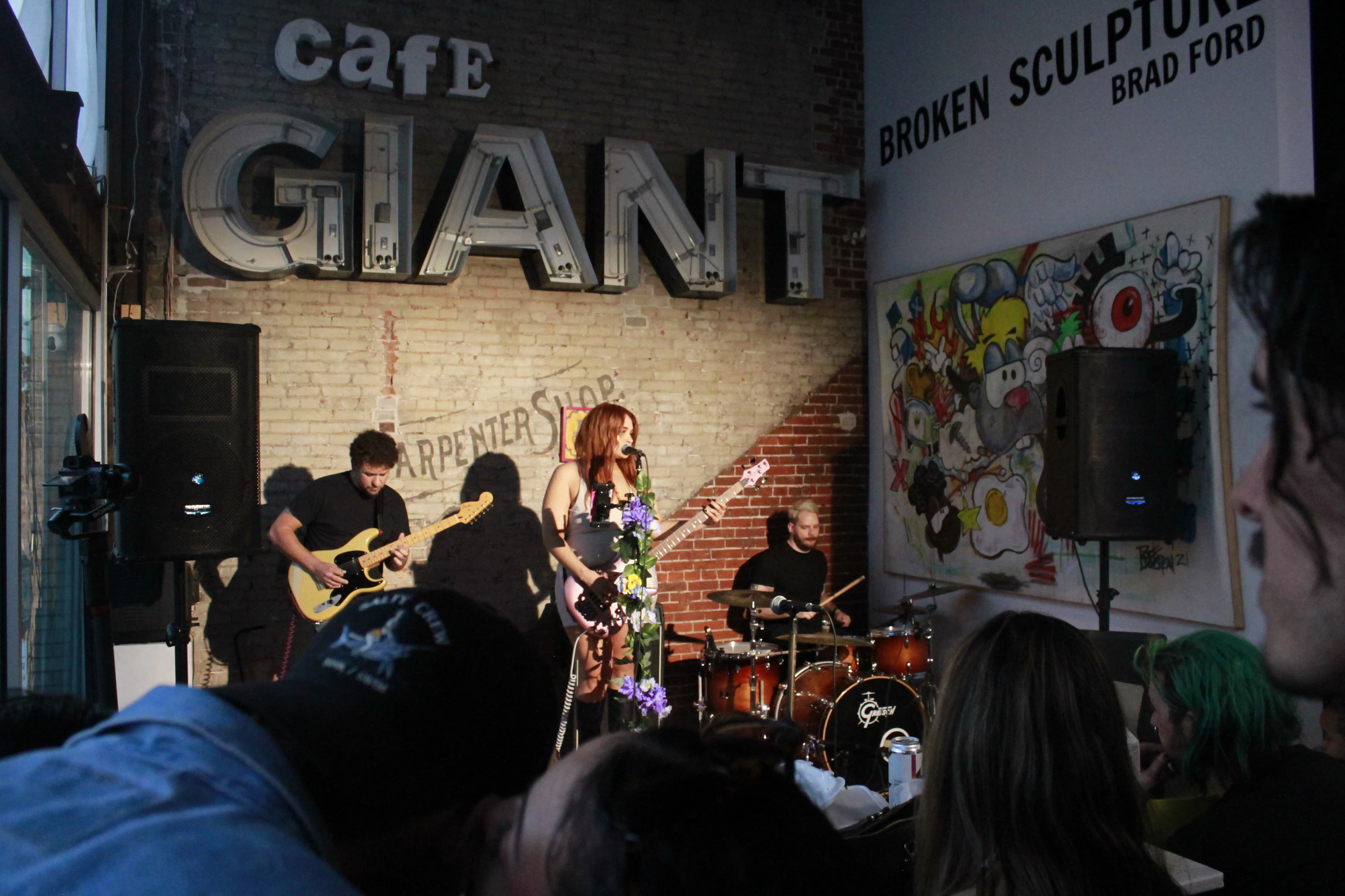 Deja Blue performing live with electric guitar and drums